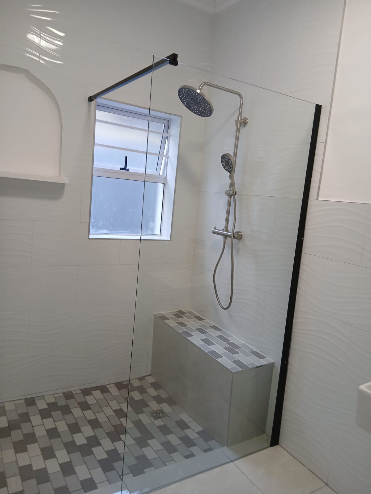 Completed glass shower plumbing installation